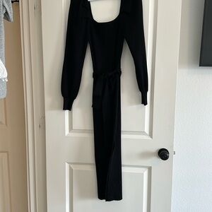 Black long sleeve dress with belt. Very flattering on! Worn once.